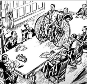 Mr Otto, convincing the Beeza board of his dicycle's stability.