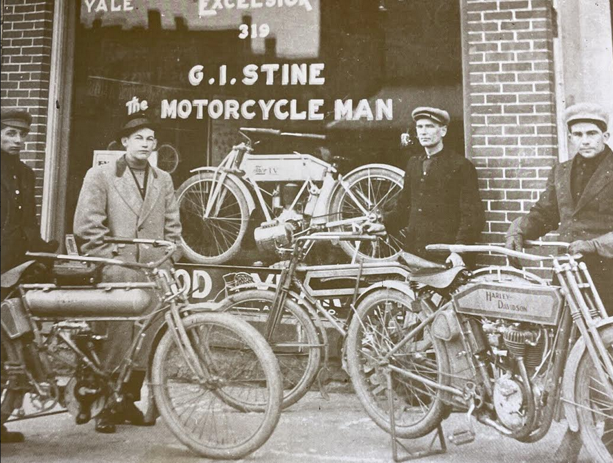 1910s GROUP AT BIKE SHOP