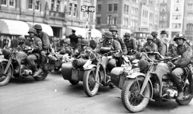 Another day, another city. These SS  Panzergrenadiers are riding through Amsterdam.
